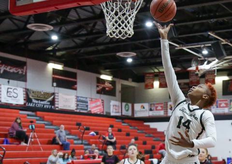 Fort White forward Isreal Hart makes a layup against Branford last season. (FILE)