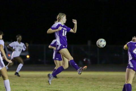 Columbia's Mia Brasel passes the ball up the field in a match against Buchholz last season. (BRENT KUYKENDALL/Lake City Reporter)