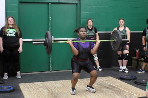 Columbia lifter Amaya Hawkins performs the clean and jerk during Monday's meet against Suwannee. (COURTESY)