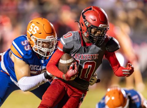 Lafayette receiver Jordan Murphy tries to escape a tackle from Branford defensive lineman Tate Dampier on Sept. 29. (JACK HOWDESHELL/Special to the Reporter)