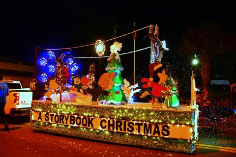 A float featuring characters from Peanuts rides along the parade route during the 2022 Christmas on the Square festivities in Live Oak. (ROB WOLFE/Special to the Reporter)
