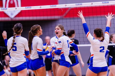 Branford outside hitter Kayley Johnson (middle) celebrates with teammates after a lull against Newberry during the Class 1A state semifinals on Monday at Polk State College. (JACK HOWDESHELL/Special the Reporter)