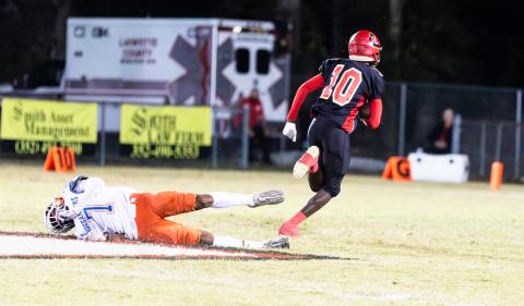 Lafayette receiver Jordan Murphy runs by Branford defensive back Arkayvion Jones on his way to the game’s opening touchdown. (JACK HOWDESHELL/Special to the Reporter)