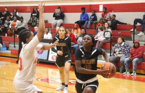 Columbia guard Ayesha Broxey (10) drives to the basket as guard Mariah Cox looks on from the background in the first half of Wednesday’s win over Santa Fe. (MORGAN MCMULLEN/Lake City Reporter)