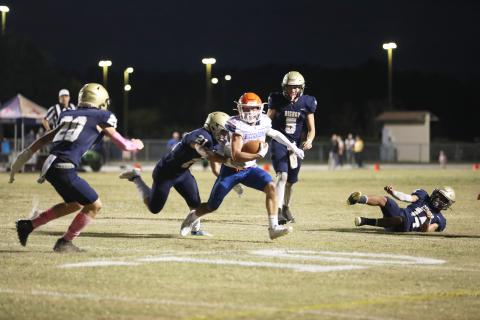 Branford receiver Austin Malaguti runs through the Bishop McLaughlin Catholic defense last Friday. (ERIN ROBERTS/Special to the Reporter)