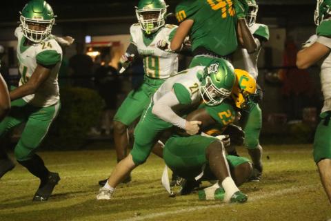 Suwannee defensive lineman Hunter Watson wraps up Pensacola Catholic running back Nigel Nelson on Friday night. (JAMIE WACHTER/Lake City Reporter)