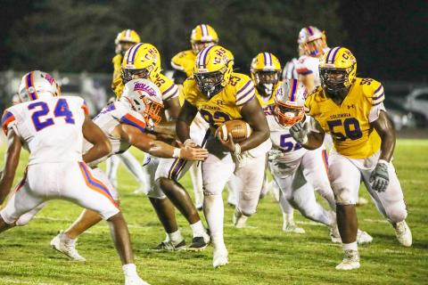 Columbia running back Jonathan Andrews runs up the field against Bolles on Oct. 6. (BRENT KUYKENDALL/Lake City Reporter)