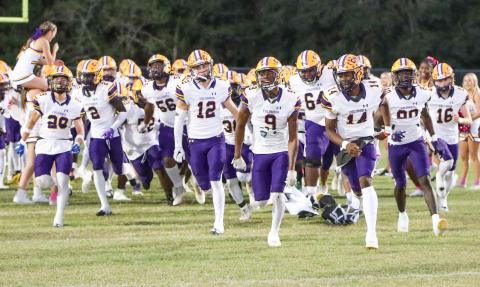 Columbia’s football team takes the field prior to a matchup against Ridgeview on Oct. 27. (BRENT KUYKENDALL/Lake City Reporter)