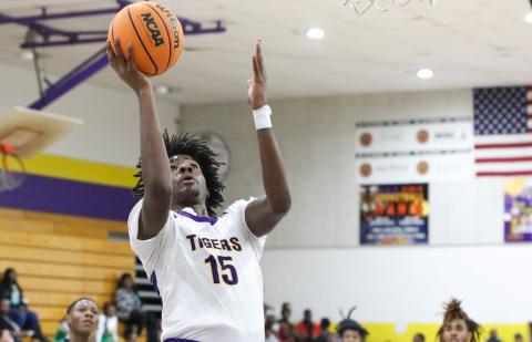Columbia forward Zavian Douglas makes a layup against Suwannee on Nov. 28. (BRENT KUYKENDALL/Lake City Reporter)