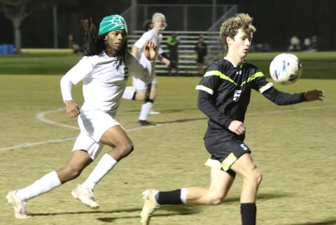 Columbia's Nathan Matsubara (5) gets control of the ball near the Eastside goal during the first half of Thursday's game. (MORGAN MCMULLEN/Lake City Reporter)