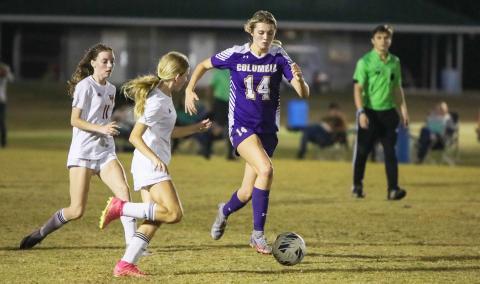 Columbia's Mia Brasel dribbles up the field against Florida High on Dec. 1. (BRENT KUYKENDALL/Lake City Reporter)