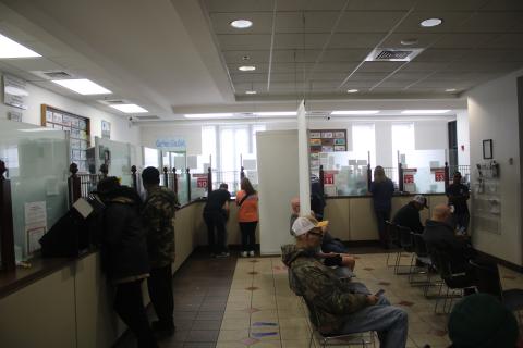 Several stations at the Columbia County Tax Collector Office serve customers as other patrons await their turn. The office served more than 600 customers on Friday, the final business day of the year. (TONY BRITT/Lake City Reporter)