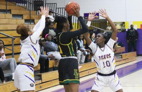 Columbia guards Mariah Cox (left) and Ayesha Broxey (right) trap Ed White center Leandrea McCloud in the backcourt on Wednesday. (JORDAN KROEGER/Lake City Reporter)
