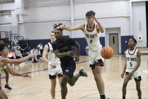 Columbia guard Zamarion Jones fires a pass through The Rock defense during the Hitchcock's Challenge on Saturday. (JORDAN KROEGER/Lake City Reporter)