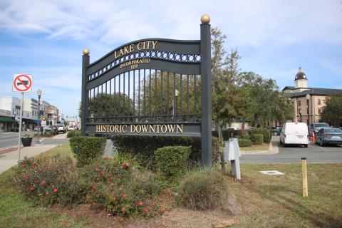 One of the City of Lake City’s historic downtown gate signs sits at Duval Street at the intersection with Marion Avenue. The sign on the north end of the historic downtown district was taken down this week to be moved further north. (TONY BRITT/Lake City Reporter)