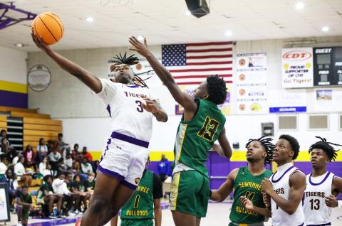 Columbia guard Zamarion Jones rises through the Suwannee defense for a layup on Nov. 28. (BRENT KUYKENDALL/Lake City Reporter)