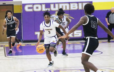 Columbia guard Zamarion Jones dribbles up the floor in transition during Thursday's game against Orange Park. (JORDAN KROEGER/Lake City Reporter)