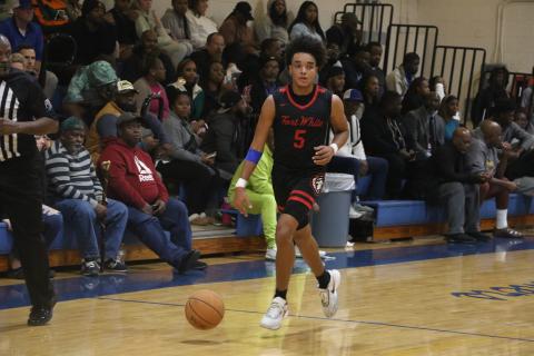 Fort White guard Tafari Moe dribbles down the court during a Dec. 6 game against Newberry. (FILE)