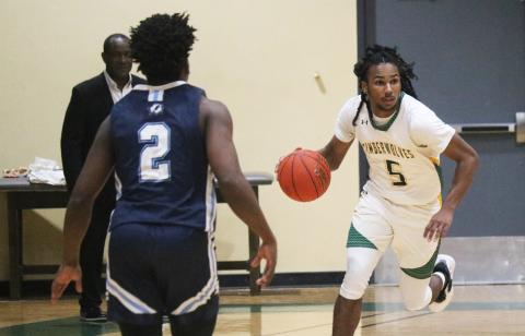FGC guard Amayoa’ah Phillips dribbles the ball up the floor against Santa Fe College on Dec. 7. (JORDAN KROEGER/Lake City Reporter)