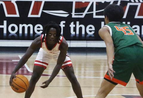 Fort White guard Najeeb Smith runs the offense against Eastside on Dec. 22. (MORGAN MCMULLEN/Lake City Reporter)