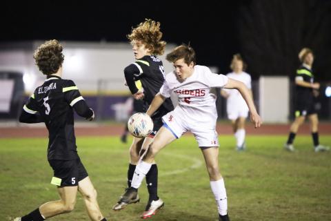 Columbia’s Brendan Schwartz (left) and Santa Fe’s Clayton Morgan battle for possession of the ball on Friday night. (BRENT KUYKENDALL/Lake City Reporter)
