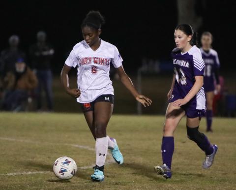 Fort White's Anndersn Fuller dribbles up the field against Columbia on Dec. 21, 2023. (BRENT KUYKENDALL/Lake City Reporter)