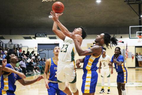 FGC forward Joseph Mitchell gets up a shot against the FSCJ defense on Wednesday night. (JORDAN KROEGER/Lake City Reporter)