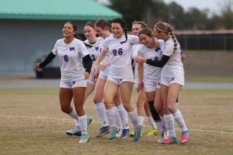 Branford players celebrates a goal by Savannah Creech (18) during Saturday's match against Fort White. (PAUL BUCHANAN/Special to the Reporter)