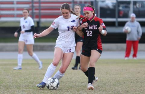 Branford's Emma Soride dribbles while being defended by Fort White's Gabriella Serrano on Jan. 13. (PAUL BUCHANAN/Special to the Reporter)