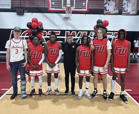 Fort White held Senior Night on Saturday against Baker County. Pictured are Garrett Brady (from left, Brandon Lumpkins, Maliki Clark, head coach Elvin Sheppard, Najeeb Smith, Brandon DeMartino and Percyse Bohler. (COURTESY)