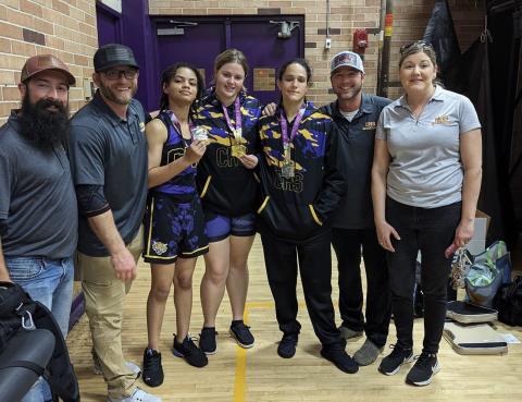Columbia wrestler Josie Raulerson (middle) won 235 class at the Fletcher Beach Brawl on Saturday, while Bella Guerrier-Lajoir (left of Raulerson) and Carlee Morrison (right of Raulerson) each placed second. (COURTESY)