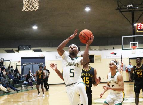 FGC guard Amayoa’ah Phillips rises for a layup against Palm Beach State College on Wednesday night. (JORDAN KROEGER/Lake City Reporter)