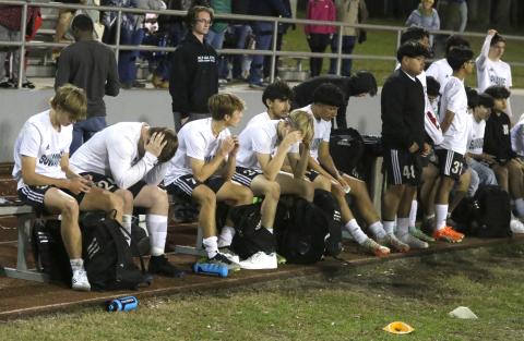 Suwannee’s bench sits disappointed after dropping a 3-1 decision in Tuesday’s District 2-4A championship match. (MORGAN MCMULLEN/Lake City Reporter)