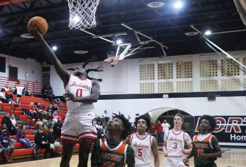 Fort White guard Najeeb Smith makes a layup against Eastside on Dec. 22. (MORGAN MCMULLEN/Lake City Reporter)