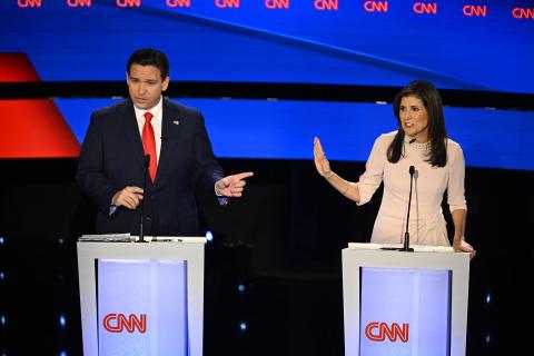 Florida Gov. Ron DeSantis (left) and former U.S. Ambassador to the UN Nikki Haley speak during the fifth Republican presidential primary debate, at Drake University on Wednesday in Des Moines, Iowa. (JIM WATSON/AFP/Getty Images/TNS)