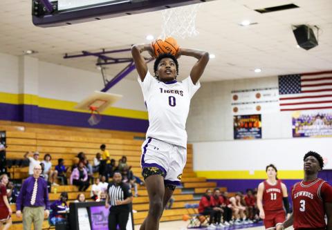 Columbia guard Noah Wilson rises for a dunk against Lowndes on Tuesday night. (BRENT KUYKENDALL/Lake City Reporter)