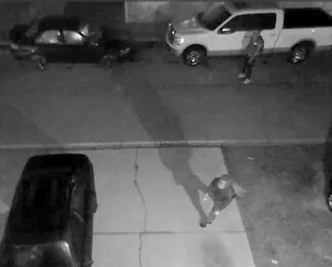 A still image from video surveillance released by the Lake City Police Department shows suspects checking out vehicles to burglarize. (COURTESY)