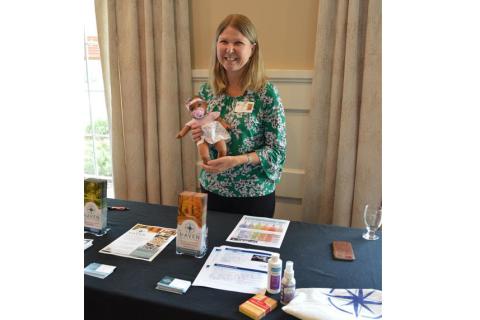 Haven Hospice Dementia Care program manager Anita Howard displays some of the resources provided by the program, including enrichment tools and educational materials for caregivers. The Plein Foundation awarded Haven with a grant in support of the program. (COURTESY)