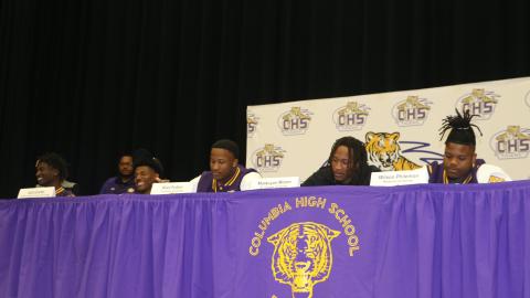Columbia football players D'Mari Bruce (from left), Jalin Carter, Kani Fulton, Markeyon Moore and Wilson Philemon signed their letters of intent to play college football on Wednesday. (JAMIE WACHTER/Lake City Reporter)