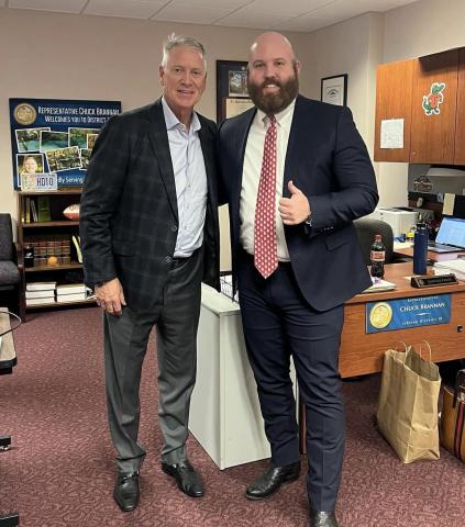Jason Carter, Rep. Chuck Brannan’s legislative aide, gets a picture with Tom Glavine during the Hall of Fame pitcher’s stop at the Capitol. (COURTESY)