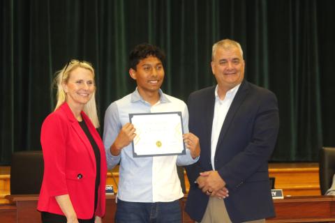 Columbia High junior Nathan Chowdhury was recognized by School Board Chair Dana Brady-Giddens (left) and Superintendent Lex Carswell (right) as the district’s Sunshine State Scholar at Tuesday’s board meeting. (JAMIE WACHTER/Lake City Reporter)