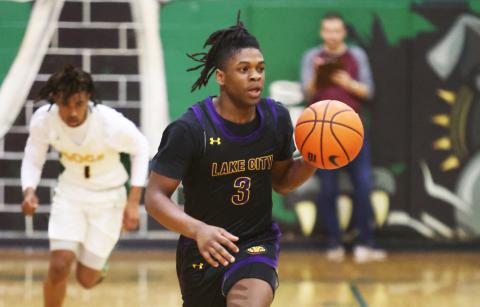 Columbia guard Zamarion Jones dribbles up the court against Suwannee on Tuesday night. (PAUL BUCHANAN/Special to the Reporter)