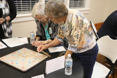 Marilyn Hamm (left) and Marcia Kazmierski look over their board in last year’s Lake City Garden Club Scrabble Tournament. (FILE)
