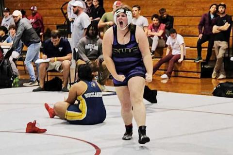 Columbia wrestler Josie Raulerson celebrates after pinning Mainland wrestler Cheyenne Wigley to win the Region 1-1A championship in the 235-pound weight class. (COURTESY)