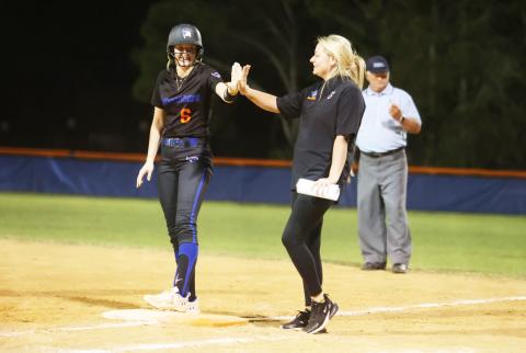 Branford's Madyson Sikes high fives an assistant coach duirng a game last season. (PAUL BUCHANAN/Special to the Reporter)