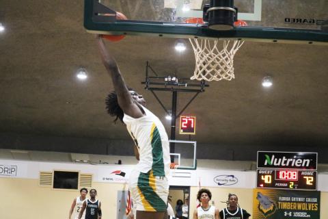 FGC forward Ty'jahn Wright rises to the basket for a dunk against Thomas University JV on Thursday night. (JORDAN KROEGER/Lake City Reporter)