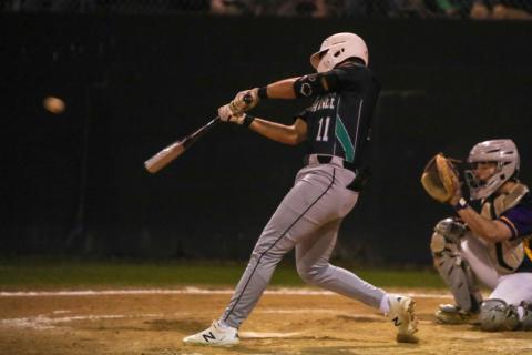 Suwannee’s Logan Brooks makes contact with a pitch against Columbia on Feb. 29. (BRENT KUYKENDALL/Lake City Reporter)