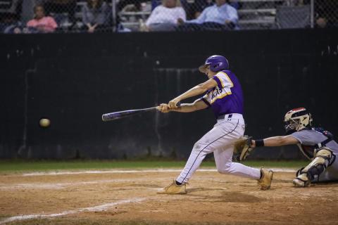 Columbia’s Grant Bowers makes contact with a pitch against St. Johns Country Day on March 1. (BRENT KUYKENDALL/Lake City Reporter)