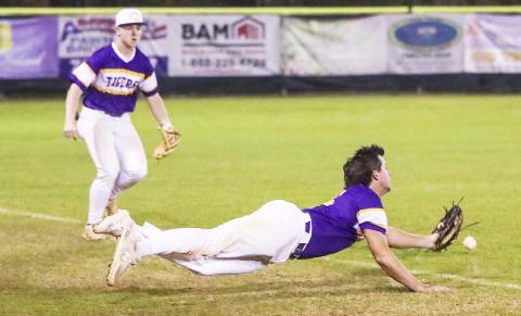 Columbia third baseman Brett Jones can’t track down a pop up that lands just inside the foul line during Friday’s game against St. Johns Country Day. (BRENT KUYKENDALL/Lake City Reporter)