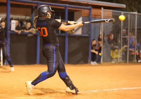 Branford's Ellie Frierson makes contact with a pitch against Fort White on March 1. (PAUL BUCHANAN/Special to the Reporter)